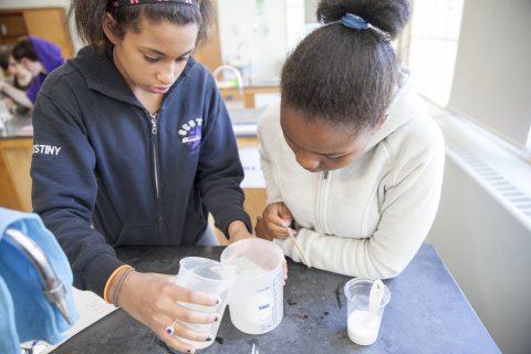 Two students working in a science lab